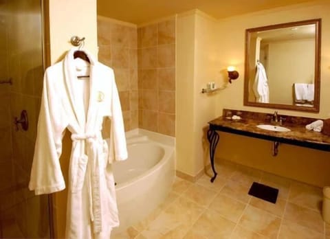 Combined shower/tub, designer toiletries, hair dryer, bathrobes