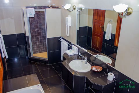 Family Suite, 2 Queen Beds | Bathroom | Separate tub and shower, jetted tub, rainfall showerhead