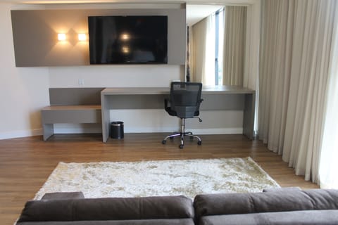 Suite, 1 King Bed | Living area | LED TV, DVD player