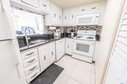 Standard Condo, 2 Bedrooms | Private kitchen | Fridge, microwave, oven, stovetop