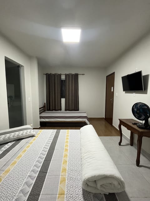 Family Room | Minibar, desk, blackout drapes, iron/ironing board