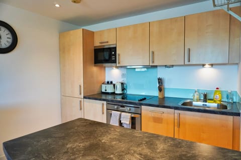 Apartment, 1 King Bed | Private kitchen | Fridge, microwave, oven, stovetop