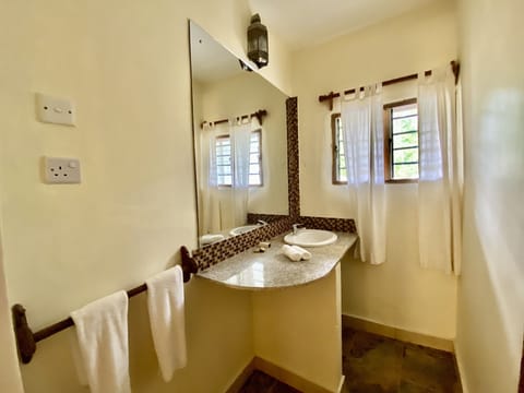 Luxury Suite, 2 Bedrooms | Bathroom | Shower, rainfall showerhead, free toiletries, hair dryer