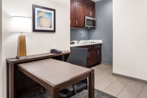 Desk, laptop workspace, blackout drapes, iron/ironing board