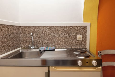 Triple Room, Balcony | Private kitchen | Mini-fridge, stovetop, highchair, cookware/dishes/utensils