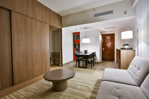 Deluxe Suite, 1 King Bed | Living area | 32-inch LED TV with satellite channels, TV