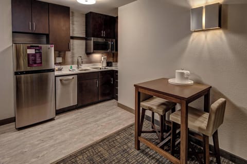 Studio, 1 King Bed, Non Smoking | Private kitchen | Full-size fridge, microwave, stovetop, dishwasher