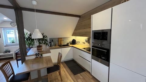 Apartment | Private kitchen | Fridge, stovetop, electric kettle, cookware/dishes/utensils