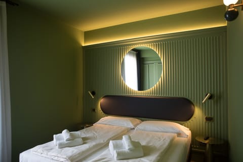 Double or Twin Room, Balcony | In-room safe, desk, free WiFi, bed sheets