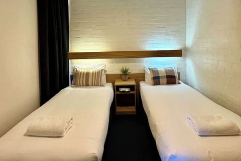 Room, Multiple Beds, Non Smoking | Premium bedding, blackout drapes, iron/ironing board, free WiFi