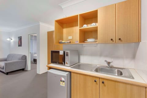 Suite, 1 King Bed, Non Smoking | Premium bedding, blackout drapes, iron/ironing board, free WiFi