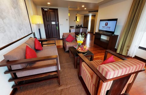 Executive Suite, 1 King Bed | Living area | 32-inch LCD TV with satellite channels, TV