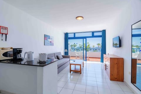 Superior Apartment, Ocean View (Double) | Living room | 20-inch LED TV with satellite channels, TV