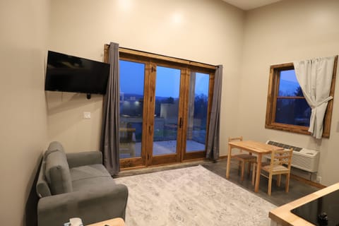 Deluxe Chalet, 1 King Bed, Accessible, Lake View | Living area | LED TV