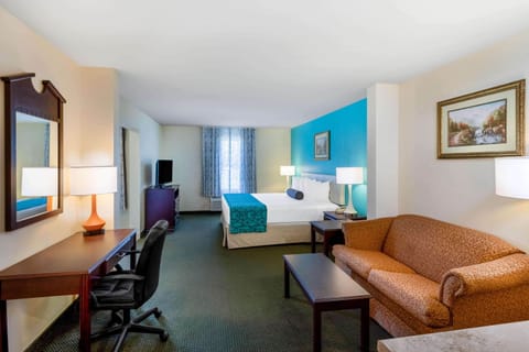 Suite, 1 King Bed, Jetted Tub | In-room safe, desk, iron/ironing board, free cribs/infant beds