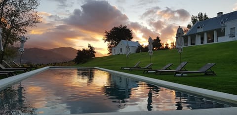 Outdoor pool, pool umbrellas, sun loungers