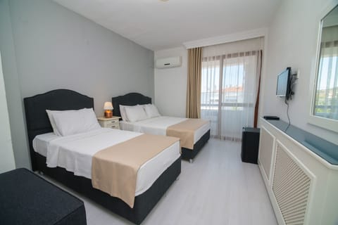 Standard Triple Room, Balcony | Premium bedding, minibar, in-room safe, desk