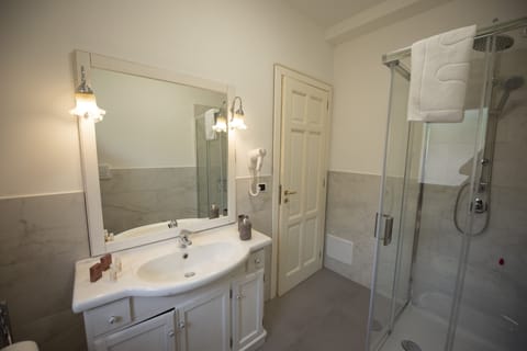 Triple Room, Sea View | Bathroom | Rainfall showerhead, free toiletries, hair dryer, bathrobes