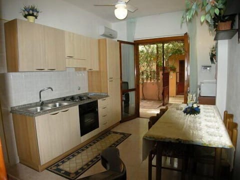 Apartment, 3 Bedrooms | Private kitchen | Full-size fridge, microwave, oven, stovetop