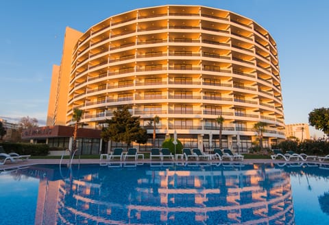 Indoor pool, outdoor pool, pool umbrellas, sun loungers