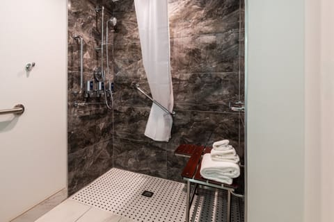 Combined shower/tub, designer toiletries, hair dryer, towels