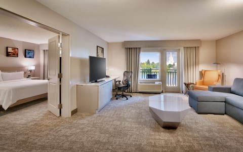 King Riverview Suite | Living area | 50-inch flat-screen TV with satellite channels, TV