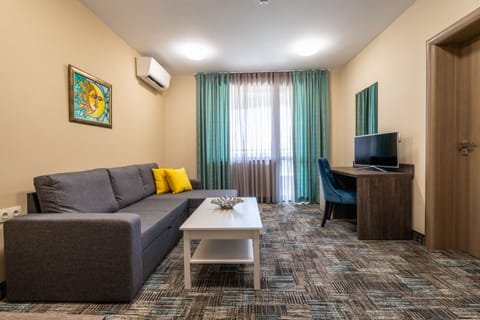 Junior Suite, Balcony | Living area | Flat-screen TV