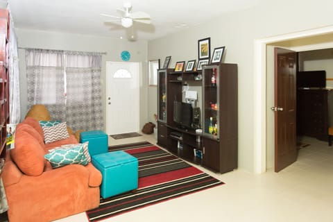 Family House, 2 Bedrooms, Kitchen, Partial Ocean View | Living room | 50-inch flat-screen TV with cable channels, TV, DVD player