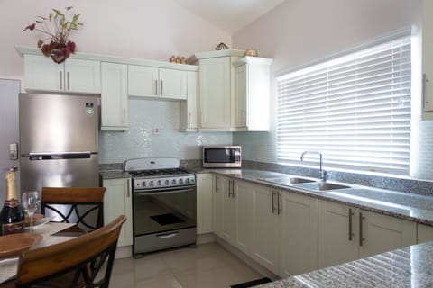 Deluxe Room, 2 Bedrooms, Pool Access, Garden View | Private kitchen | Full-size fridge, microwave, oven, stovetop