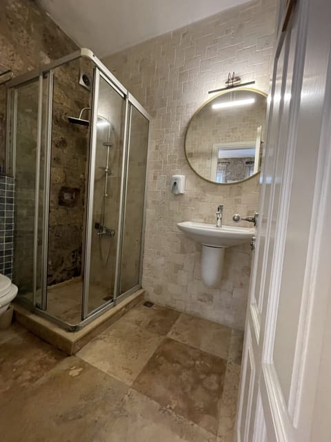 Shower, free toiletries, hair dryer, slippers