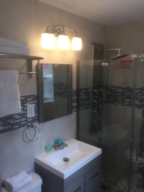 Shower, hydromassage showerhead, designer toiletries, bathrobes