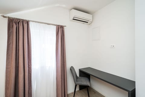 Apartment, 2 Bedrooms, Balcony, Sea View | In-room safe, desk, blackout drapes, iron/ironing board