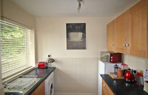 Classic Apartment, 2 Bedrooms, Non Smoking, Garden View | Private kitchen | Full-size fridge, microwave, oven, stovetop