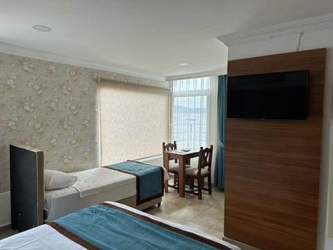 Luxury Triple Room, Sea View | Premium bedding, desk, laptop workspace, soundproofing