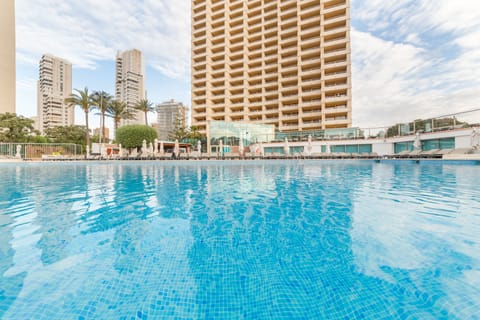 Outdoor pool, pool umbrellas, sun loungers