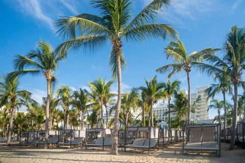 On the beach, sun loungers, beach umbrellas, beach towels