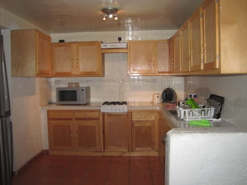 Fridge, microwave, cookware/dishes/utensils