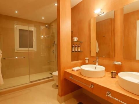 Designer toiletries, hair dryer, bathrobes, slippers
