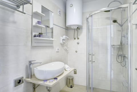 Shower, free toiletries, hair dryer, slippers