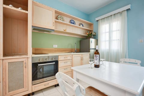 Apartment | Private kitchen | Fridge, stovetop, electric kettle, cookware/dishes/utensils