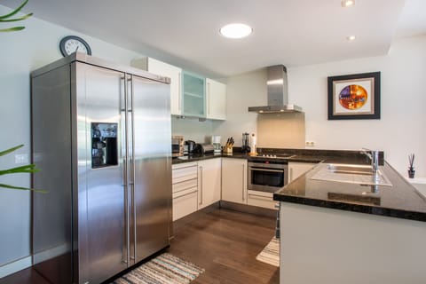 Deluxe Apartment, 2 Bedrooms, Pool Access | Private kitchen | Full-size fridge, oven, stovetop, dishwasher