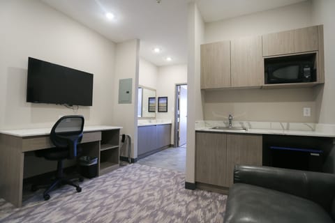 Suite, 2 Queen Beds, Non Smoking | Desk, laptop workspace, blackout drapes, iron/ironing board