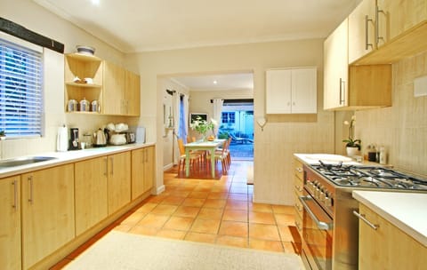 Hout Bay Beach Cottage | Private kitchen | Full-size fridge, microwave, oven, stovetop