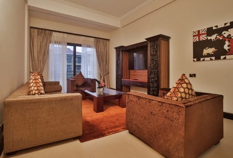 Presidential Suite | Living area | 40-inch flat-screen TV with cable channels, TV, pay movies