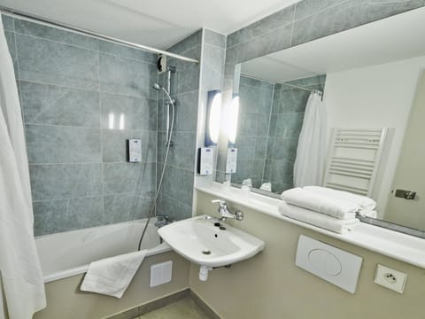 Deep soaking tub, eco-friendly toiletries, hair dryer, towels