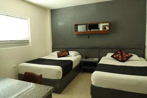 Suite, 2 Double Beds | Minibar, desk, soundproofing, iron/ironing board