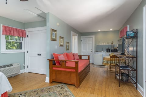 Luxury Cottage, Kitchenette, Garden View | Living area | 32-inch Smart TV with cable channels, TV