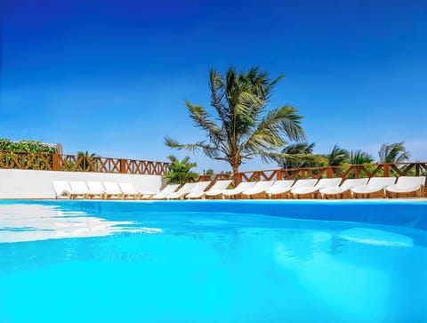 Outdoor pool, open 9:00 AM to 9:00 PM, sun loungers