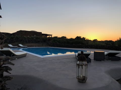 An infinity pool, sun loungers