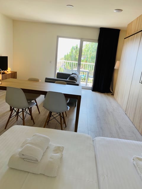 Premium Studio, 1 Bedroom, Beach View | In-room safe, desk, free WiFi, bed sheets